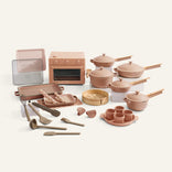 Set of kitchen appliances and utensils on a white background