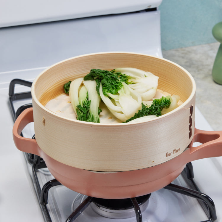 A Spruce Steamer steams bok choy atop a pink Always Pan