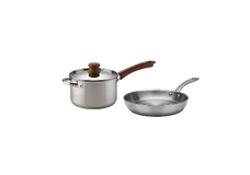 A stainless steel saucepan with a lid and wooden handle next to a stainless steel frying pan with a metal handle, both on a plain white background.