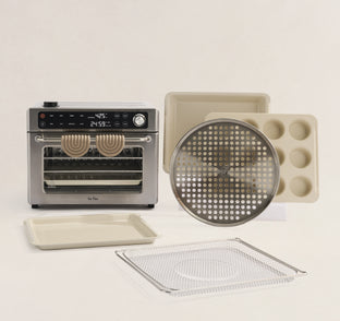 Kitchen appliance with various accessories on a light background