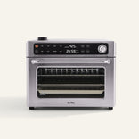 Stainless steel countertop oven with digital display set to 425°F and 24:59 timer, featuring control knobs and a clear glass door showing racks inside.
