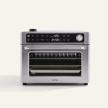 Stainless steel countertop oven with digital display set to 425°F and 24:59 timer, featuring control knobs and a clear glass door showing racks inside.