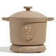 A beige electric multi-cooker with a digital display and control buttons on the front, placed on a matching base against a plain background.
